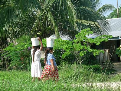 Women carrying buckets
